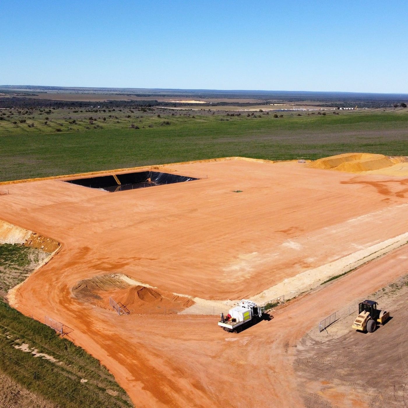 Drone view of a lined pad and sumps under construction in cropping country, 2022